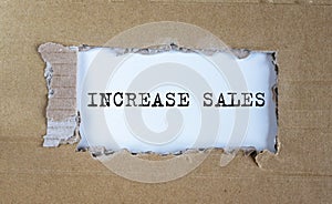 Increase sales inscription words on paper on table