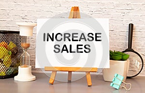 INCREASE SALES text on blackboard. Increase sale words, definition concept.