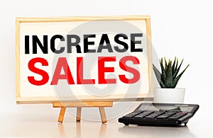 Increase sales text concept write on notebook