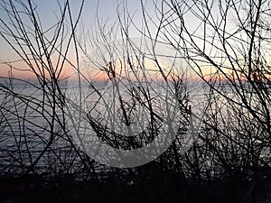 An incredibile caption of the beautiful sunset over the sea of Genova by night with some beautiful lights photo