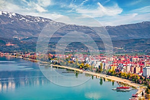 Incredibl spring cityscape of Pogradec town. Wonderful outdoor scene of Ohrid lake.