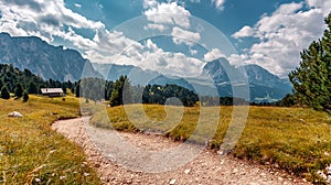 Incredible alpine highlands in summer in Dolomites Alps. Scenic image of famous Sassolungo peak. Splendid landscape in