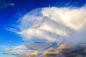 Incredible lenticular clouds in sky during sunset. Fiery orange sunset sky with colorful combinations of colors and