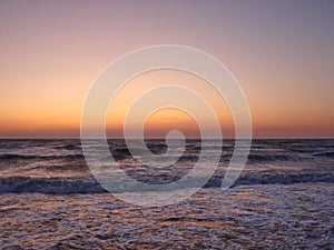 Natural picture of the rainbow colors of sunrise on the coast of the Azov Sea.