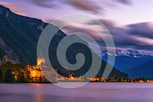 Incredible night scene with Chateau Chillon illuminated in twilight, Geneva Lake, Montreux, canton of Vaud, Switzerland