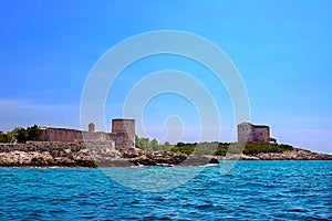 Incredible seascape. Old tower on a rocky shore by the sea, Boka-Kotor Bay,