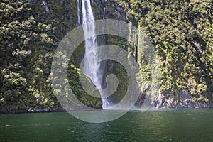 Incredible Stirling Falls with double rainbow, Milford Sound, Fiordland, South Island, New Zealand