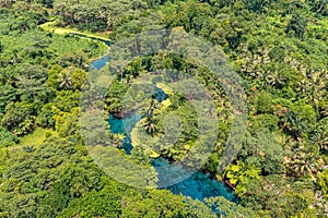 Incredible tourist landscape with a blue river in jungle forests. Top view, drone photo. Vanuatu