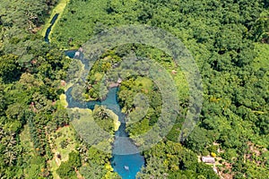 Incredible tourist landscape with a blue river in jungle forests. Top view, drone photo. Vanuatu