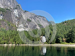 An incredible view of Chatterbox Falls at Princess Louisa Inlet with giant cliffs in the background