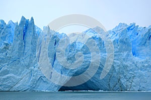 Incredible view of the ice blue Perito Moreno Glacier`s huge front wall as seen from cruise boat on Lake Argentino, El Calafate