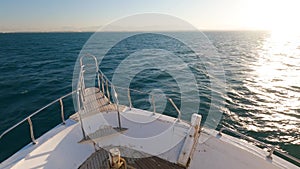 Incredible view from motor yacht on deep blue sea and luxurious white ships