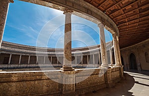 Incredible wide-angle view of galleries with columns in the inner circular patio in Palace of Charles V in Alhambra complex in