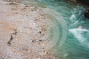 The incredibly beautiful river of turquoise color, with pine forest, summer day. Copy space. Dolomites mountains, Camping Olympia