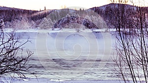 Incredibly fabulous view of the unfrozen river, surrounded by mountains.