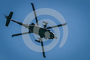 An increible helicopter flying above of you photo