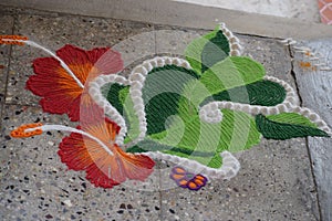 Indain festive Rangoli art of God Ganesha with jasmine flower