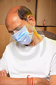 An Indain Senior citizen man with mask COVID time