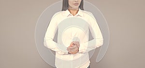 indecisive businesswoman in white shirt on grey background, ceo