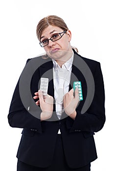 Indecisive woman with pills