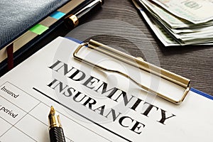 Indemnity insurance policy on a table.
