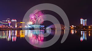 Independence Day. Night panorama of Minsk with a festive salute and colorful fireworks.