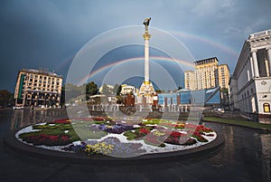 Independence Monument Column at Independence Square with a beautiful double rainbow - Kiev, Ukraine photo