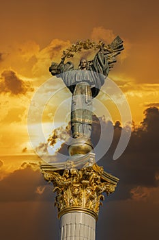 Independence monument on golden sky with clouds background in Kyiv, Ukraine