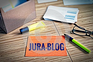 Index cards with legal issues with glasses, pen and bamboo with the german word Jura-Blog in english Law-Blog