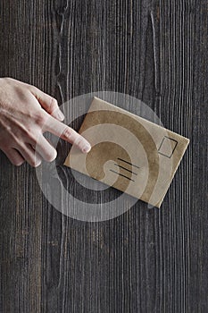 Index finger pointing on unadressed letter