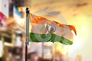 India Flag Against City Blurred Background At Sunrise Backlight