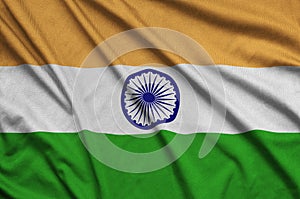 India flag is depicted on a sports cloth fabric with many folds. Sport team banner