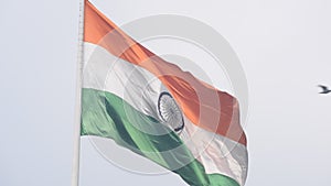 India flag flying high at Connaught Place with pride in blue sky, India flag fluttering, Indian Flag on Independence Day and