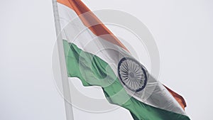 India flag flying high at Connaught Place with pride in blue sky, India flag fluttering, Indian Flag on Independence Day and