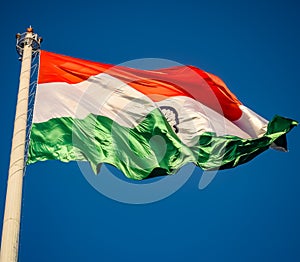 India flag flying high at Connaught Place with pride in blue sky, India flag fluttering, Indian Flag on Independence Day and