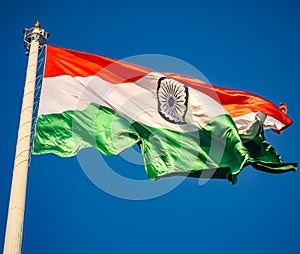 India flag flying high at Connaught Place with pride in blue sky, India flag fluttering, Indian Flag on Independence Day and