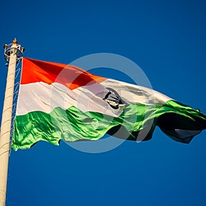 India flag flying high at Connaught Place with pride in blue sky, India flag fluttering, Indian Flag on Independence Day and photo