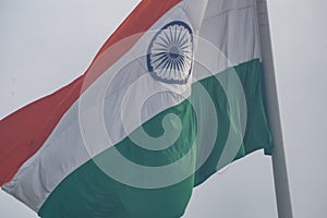 India flag flying high at Connaught Place with pride in blue sky, India flag fluttering, Indian Flag on Independence Day and photo