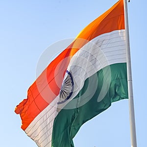 India flag flying high at Connaught Place with pride in blue sky, India flag fluttering, Indian Flag on Independence Day and photo