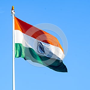 India flag flying high at Connaught Place with pride in blue sky, India flag fluttering, Indian Flag on Independence Day and photo