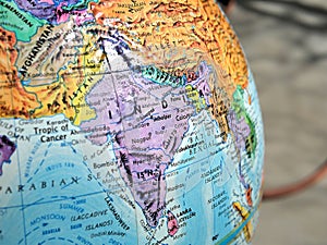 India focus macro shot on globe map for travel blogs, social media, website banners and backgrounds.