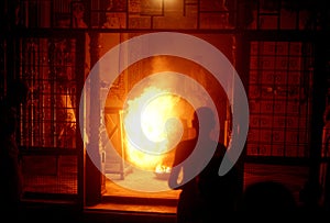 1977. India. Holika fire in a Hindu temple, the night before the Holi festival.