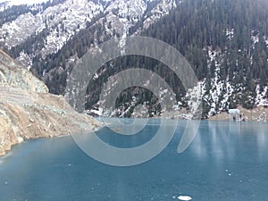 India jammu Kashmir Deep blue frozen water lake in kisnanganga River and steel Structure