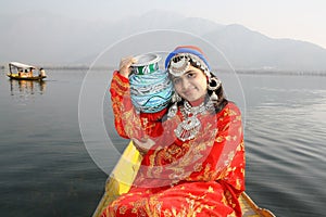 India Native Girl Carrying Water on Blue Color Pot