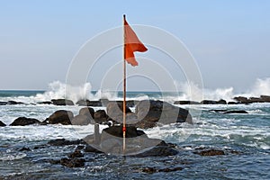India, West Bengal, Cape Comorin Kanyakumari.   Red flag in the place of Confluence of Three Seas