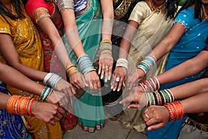 India women in dresses and wrist jewelry
