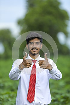 Indian Agronomist at Cotton field and showing thumps up
