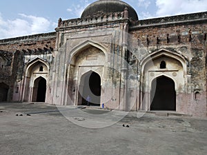 Indian ancient gate of jail wich have big wall and global architecture