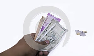 Indian/asian man and savings concept - Indian Currency Notes 5,10,20,500,2000 Hand holding on white background