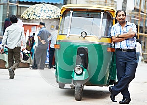 Indian auto rickshaw tut-tuk driver man photo
